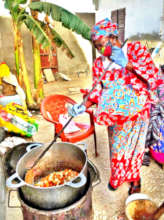 A Godmother cooking for the talibes