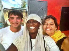 Adama welcomes volunteers Hugh and Elodie