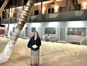 Author Sonia with the new building