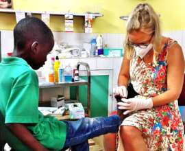 Treating a talibe's infected foot in the infirmary