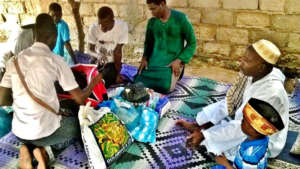 Volunteers distribute clothes and gifts in a daara