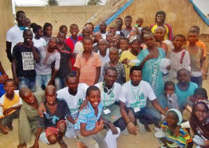 With children after installing mats, mosquito nets