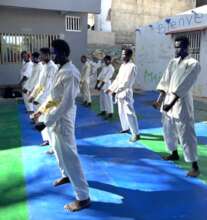 Focused and ready, the karatekas prepare to shine.