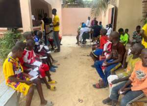 Talibe children wait patiently to be seen.