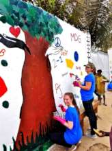 ... painting a beautiful mural outside the center