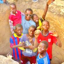 With young talibes at the Bango water well