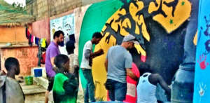 Restoring one of the center's murals