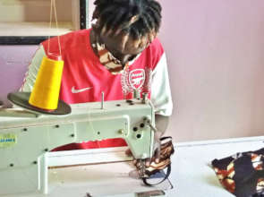 Tailoring apprentice fabricating a mask