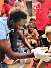 Treating a child, many others waiting