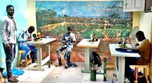 Instructor Baka Fall supervising his students