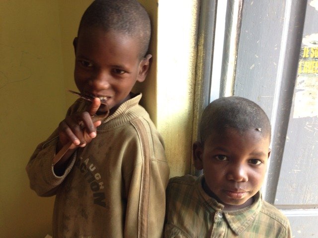 Young talibe children waiting for their gi