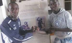 Arouna with Kalidou, studying history of slavery