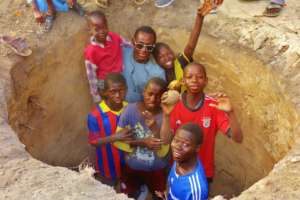 With other talibes in Bango water well