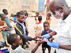 Idy Diallo distributes masks to talibe children