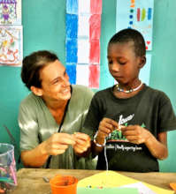 Katia helps a talibe student