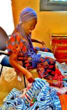 Nurse Awa preparing goodie bags