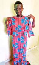 Abdoulaye proudly showing his creation