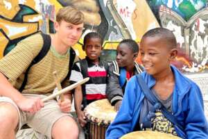 Josh in MDG center with future entrepreneurs