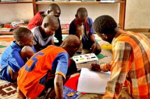 Writing their names together in the library