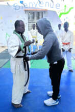 Issa presents new belt - recognition of excellence