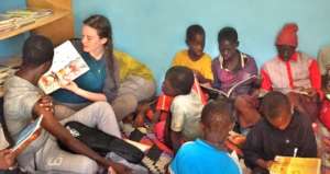 Patricia with talibes in Maison de la Gare library