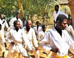 Buaro leading a karate class in MDG center