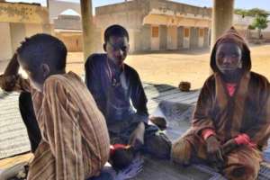 Moustapha with two other boys in the daara