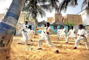 Buaro leads morning karate class in the center