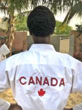 Karateka wearing uniform from Canadian supporters
