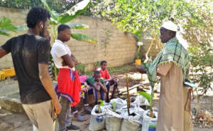 Apprentices discussing with agricultural teacher