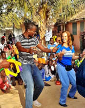 Rachel Lapierre dansing with MDG teacher Abdou