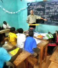 Teaching talibes students in an evening class