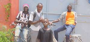 Arouna arrives home from school, to his MDG family