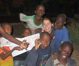 Talibe children proudly display their drawings