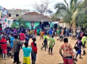 Soccer game in midst of dancing, cheering crowd