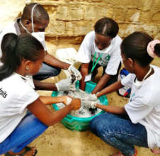 Volunteers washing laundry for talibe children