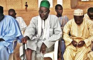 Religious leaders listen to the group in Sagna