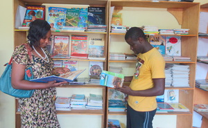Teacher Bouri and librarian Bachir study new books