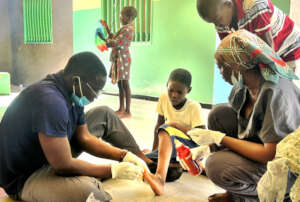 Dr. Mane treating a talibe child