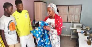 Mamadou & Kalidou deliver dress to happy customer