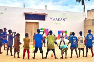 Playing with other talibe children in the yard