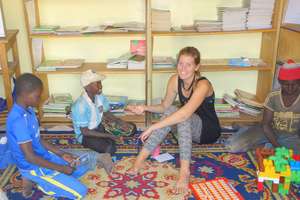 With children in Maison de la Gare's library