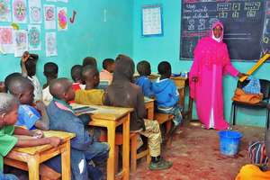 Teacher Aida introduces street children to French