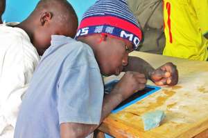 A talibe child intensely committed to learning