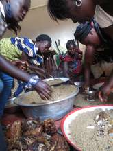 Community women prepare a feast for the children