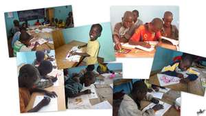 Talibes children color intently - a new experience