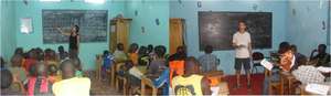 Jenny and Jerome teaching in MDG's classrooms