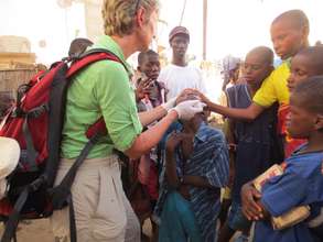 Karen Hornby treating talibe child's eye infection
