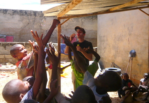 Jerome playing with children in their daara