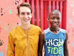 Sam with Kalidou, in Maison de la Gare's center